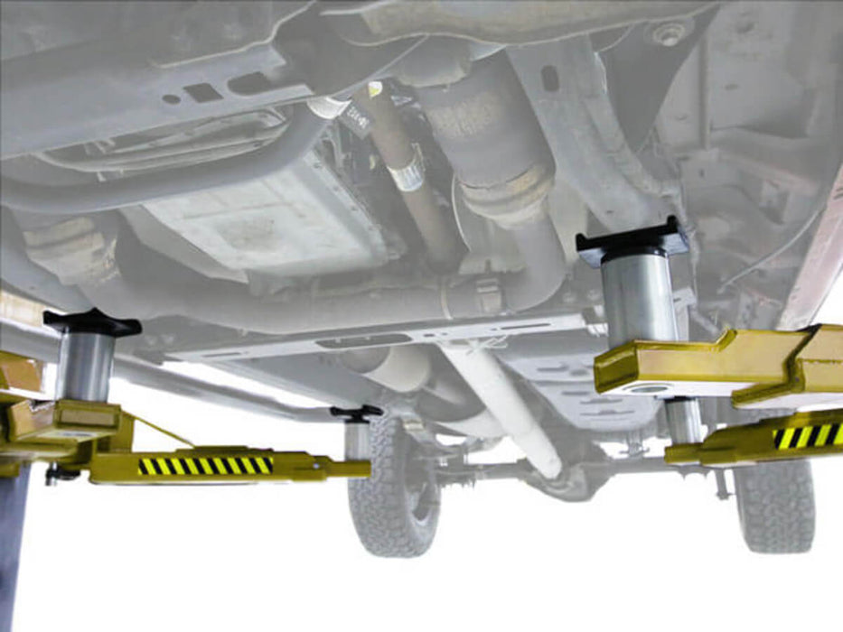 Atlas Platinum PVL15 Heavy Duty 2-Post Lift close-up view of symmetric arms underneath the vehicle